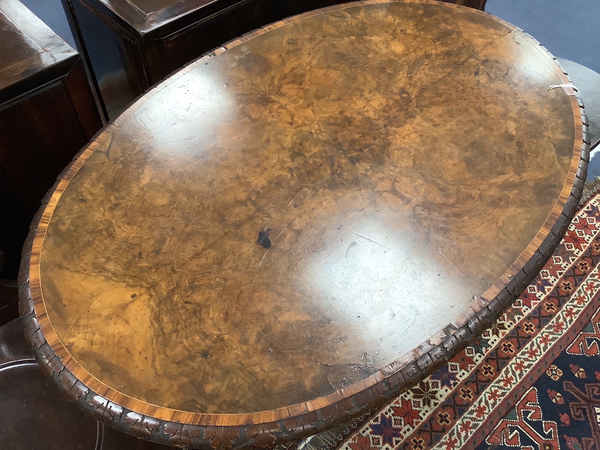 A Victorian oval tulip banded burr walnut centre table, width 104cm, depth 66cm, height 70cm